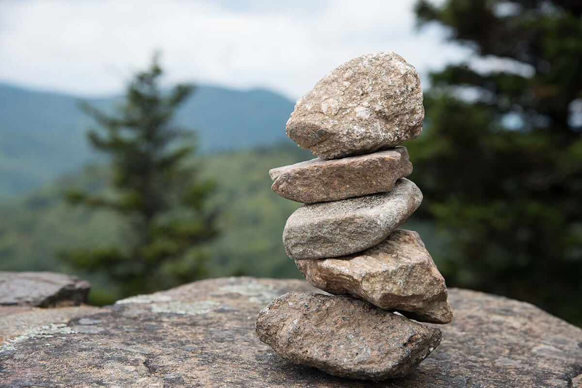 Stacked rocks to show layers of support for a client in a virtual reality exercise to reduce anxiety